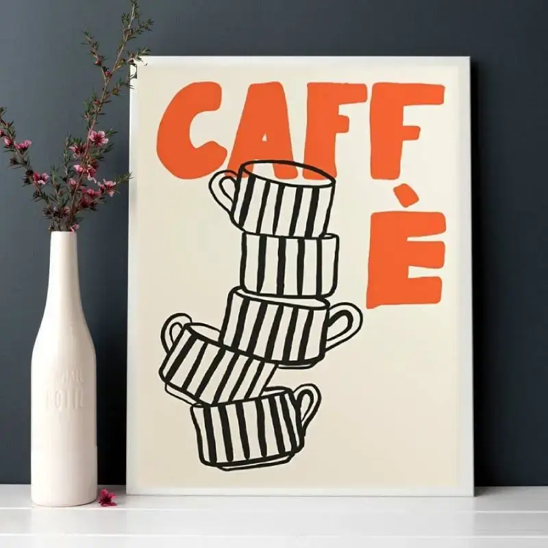 Frameless canvas wall art featuring bold orange “CAFFÈ” text and a minimalist stack of striped coffee cups in black, styled beside a white vase with flowers.